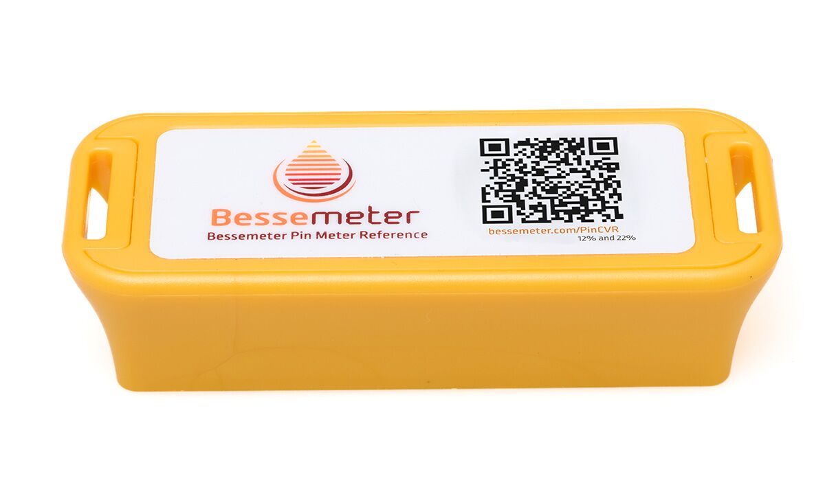 Bessemeter pin-meter calibration reference block with QR code and 12%/22% moisture check points.
