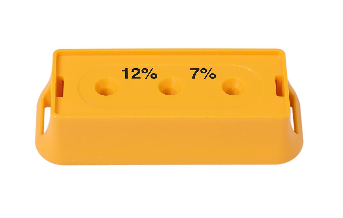 Bessemeter pin-meter calibration block with 12% and 7% moisture reference points and probe holes.
