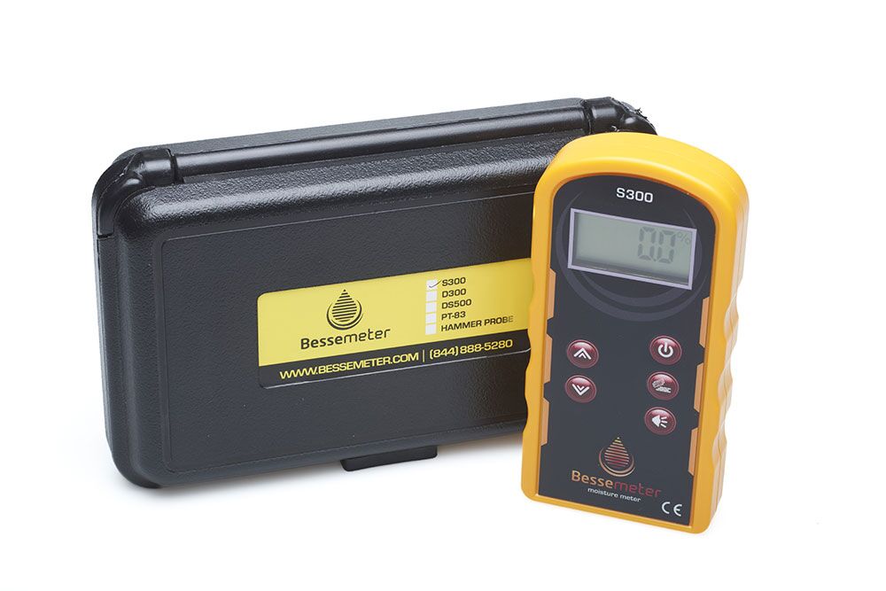 D300 Deep Scan Pinless Wood Moisture Meter sitting next to the black protective storage case with hardshell for safe carrying